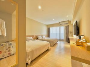 Voodi või voodid majutusasutuse Brown House Hotel - Taipei Main Station toas