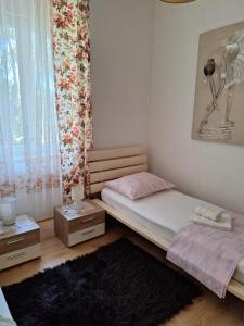 Posteľ alebo postele v izbe v ubytovaní Apartman Fiume