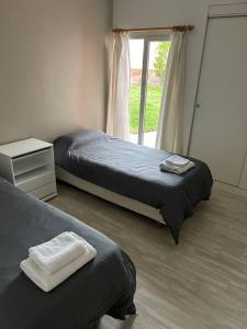 En eller flere senge i et værelse på Departamento Salta al Mar + 9 billeder