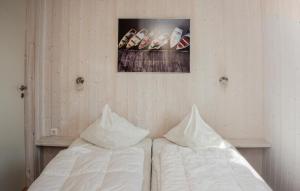 two beds sitting next to each other in a room at Friedrichskoog-Deichblick 6 in Friedrichskoog +7 photos