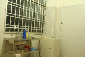 a small kitchen with a sink and a window at kluang homestay villa 1 in Kluang