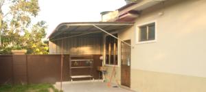 a house with awning on the side of it at kluang homestay villa 1 in Kluang