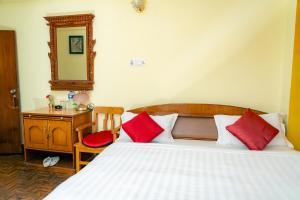 Postel nebo postele na pokoji v ubytování Golden Gate Guest House