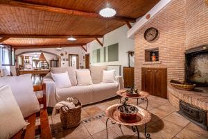 a living room with a couch and a fireplace at Copper House in Lanciano