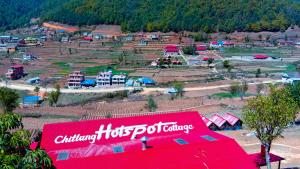 una vista aerea di un campeggio con un cartello rosso di bed and breakfast, also lunch and dinner if required a Mārkhu