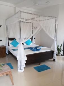 Postel nebo postele na pokoji v ubytování Bisandu guesthouse