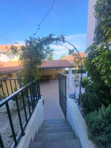 a set of stairs leading to a house with a gate at Casa da Leonor in Viseu