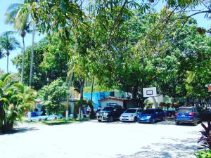 a group of cars parked in a parking lot at Rincon del mar in La Libertad +5 photos