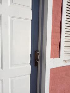 a white door with a door knob on a house at Monoambiente Blanca in Concordia