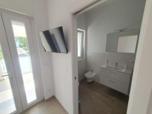 Koupelna v ubytování L'Acquaviva