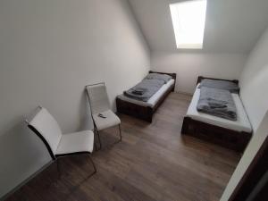 Postel nebo postele na pokoji v ubytování Penzion - sklipek Otáhalovo