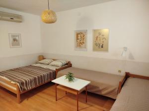 Postel nebo postele na pokoji v ubytování Apartmani Rakic