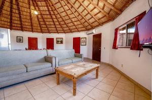 a living room with two couches and a coffee table at Short walk to pool and private beach in Don Pancho +37 photos