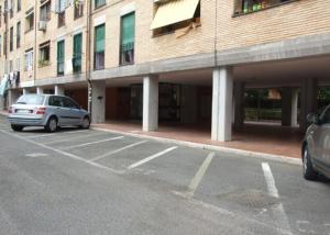 a car parked in a parking lot in front of a building at B&B Acquedotti Antichi in Rome