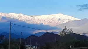 a snow covered mountain in the distance with at Vista a la montaña in Chilecito +7 photos