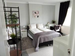 Postel nebo postele na pokoji v ubytování Hasselt House