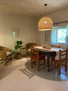 a dining room with a table and chairs at Casa al rio - Malen in Tigre