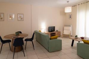 a living room with a couch and a table at Santa Marina 4 in Ioannina