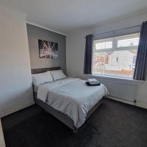 Ένα ή περισσότερα κρεβάτια σε δωμάτιο στο Belfast City house