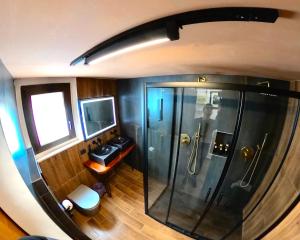 an overhead view of a bathroom with a shower at Casa nel centro storico in San Gimignano +46 photos