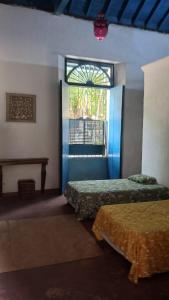 Ένα ή περισσότερα κρεβάτια σε δωμάτιο στο Casa Parima