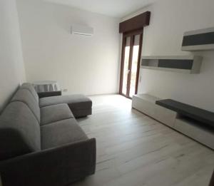 a living room with a couch and a table at Makari Sweet Sunsets in Macari
