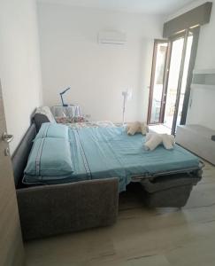 a bed in a room with two pillows on it at Makari Sweet Sunsets in Macari +37 photos