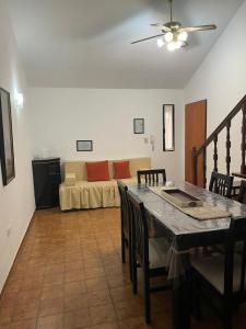 a living room with a table and a couch at Departamento A&F I planta baja in San Fernando del Valle de Catamarca