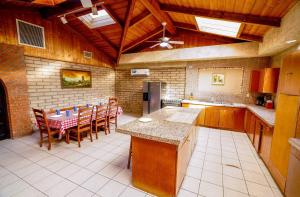a large kitchen with a table and chairs in it at Little Slice of Heaven - Amazing San Felipe Beach Rental in Don Pancho