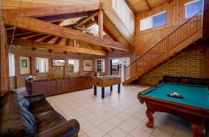 a living room with a pool table and a staircase at Little Slice of Heaven - Amazing San Felipe Beach Rental in Don Pancho +27 photos