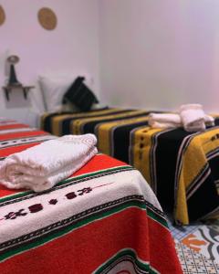 Postel nebo postele na pokoji v ubytování Riad Al Borj