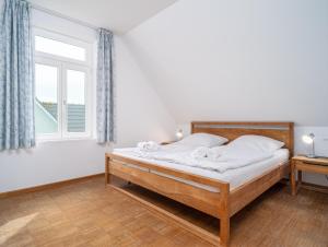 Ein Bett oder Betten in einem Zimmer der Unterkunft Haus SEEGARTEN