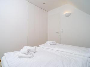 Ein Bett oder Betten in einem Zimmer der Unterkunft Haus SEEGARTEN