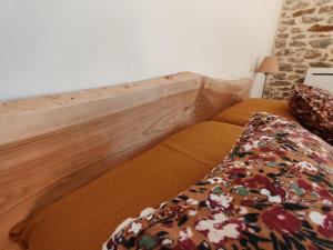 Postel nebo postele na pokoji v ubytování La Source Du Bonheur Chambres et Table d'Hôtes