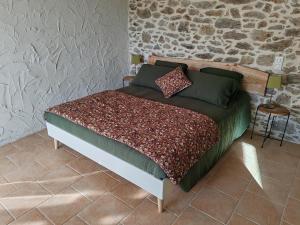 Postel nebo postele na pokoji v ubytování La Source Du Bonheur Chambres et Table d'Hôtes