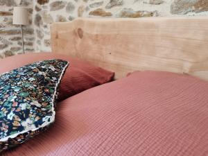 Postel nebo postele na pokoji v ubytování La Source Du Bonheur Chambres et Table d'Hôtes