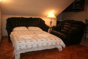 a bedroom with a bed and a couch at Spacious 2Bedroom Flat Budva Becici in Boreti