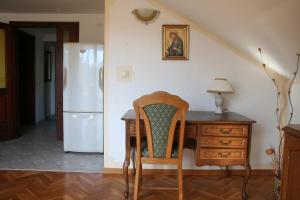 a kitchen with a desk and a white refrigerator at Spacious 2Bedroom Flat Budva Becici in Boreti
