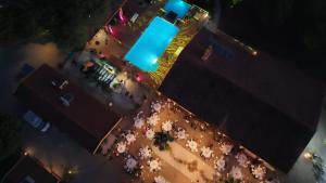 an overhead view of a street at night with a blue light at Herdade Do Rio Torto in Portel +116 photos
