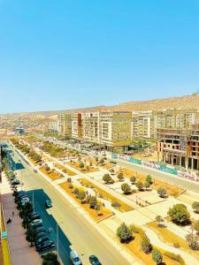 a view of a city with buildings and a street at Family Home in Agadir