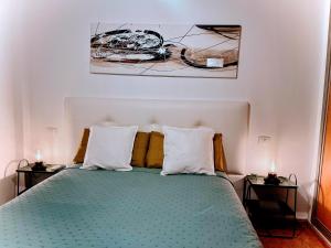 a bedroom with a bed with two side tables at Melo Home 1 Near Airport, Elevator in Vecindario