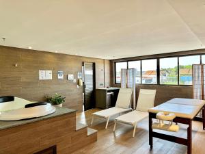 a kitchen and living room with a table and chairs at (308) Studio Âncora | Your Refuge in Holandeses in Vinhais