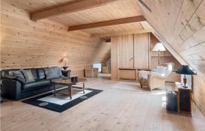 a living room with a couch and a table at Drostgården in Humble +46 photos