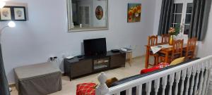 A television and/or entertainment centre at Lovely 2 Bedroom Holiday Apartment in Central Caleta de Fuste