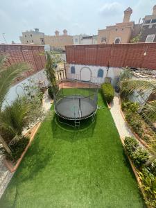 an aerial view of a yard with a gazebo at JAR villa in Al Kura