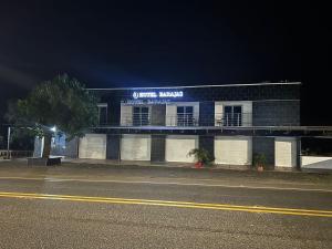 a building with a sign on the side of it at Hotel barajas in Plazabonita