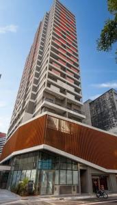 a large tall building with a building at Studio Avenida Paulista - Nex One Consolação in Sao Paulo +17 photos