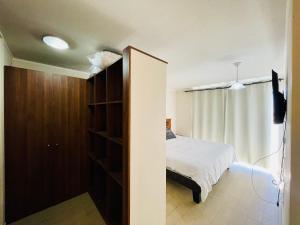 Katil atau katil-katil dalam bilik di Apartamento en Espacio Parque