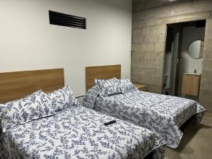Postel nebo postele na pokoji v ubytování Hospedaje San Diego