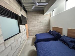Postel nebo postele na pokoji v ubytování Hospedaje San Diego